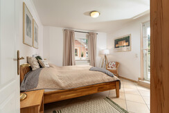 Bedroom 1 with entrance to the terrace